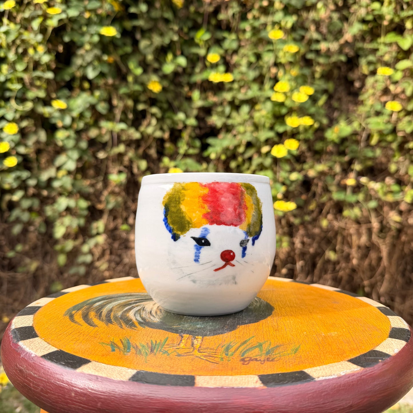 Sad clown cat